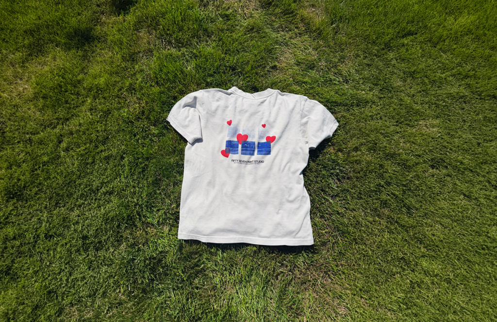Custom printed T-shirt displayed on grass